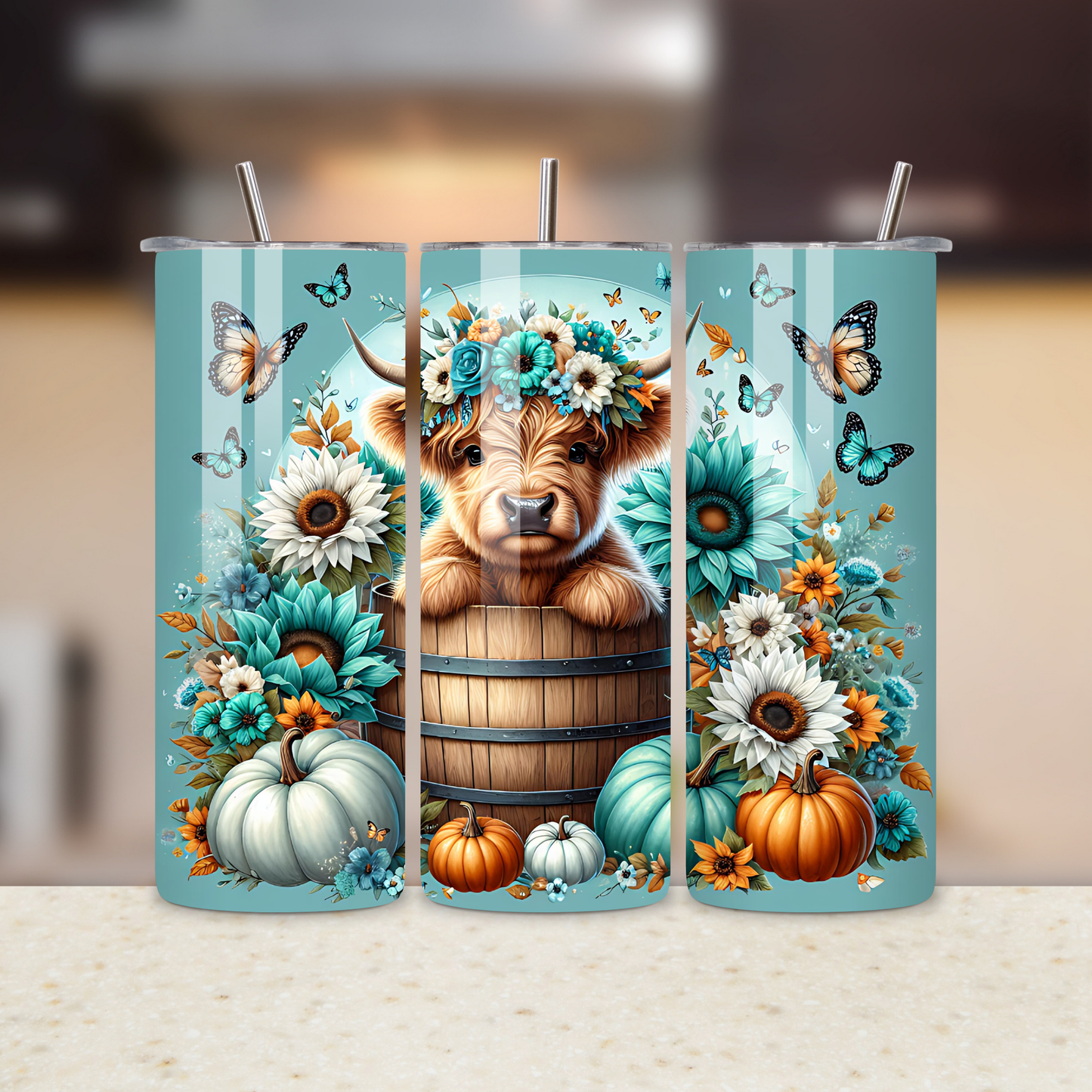 Decorative tumbler with a Highland cow, flowers, and pumpkins on a blurred background