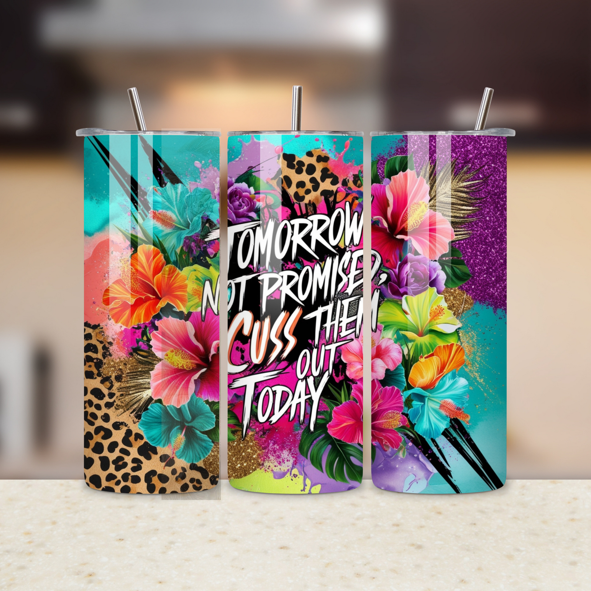Colorful tumbler with floral design and text on a blurred background