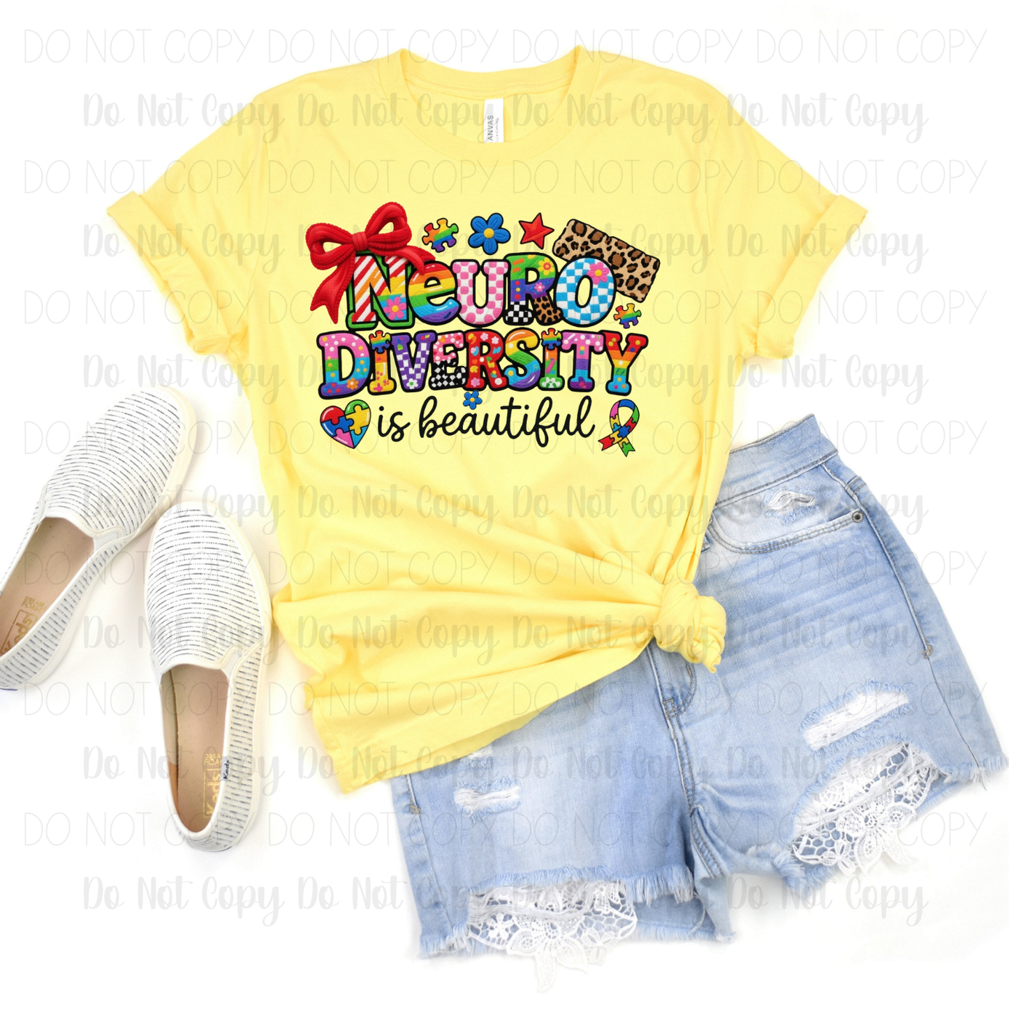 Yellow t-shirt with 'Neurodiversity is Beautiful' text, paired with denim shorts and white shoes on a white background.